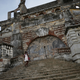 A woman climbs the stairs on the remains of Sans-Souci Palace in Milot, Haiti